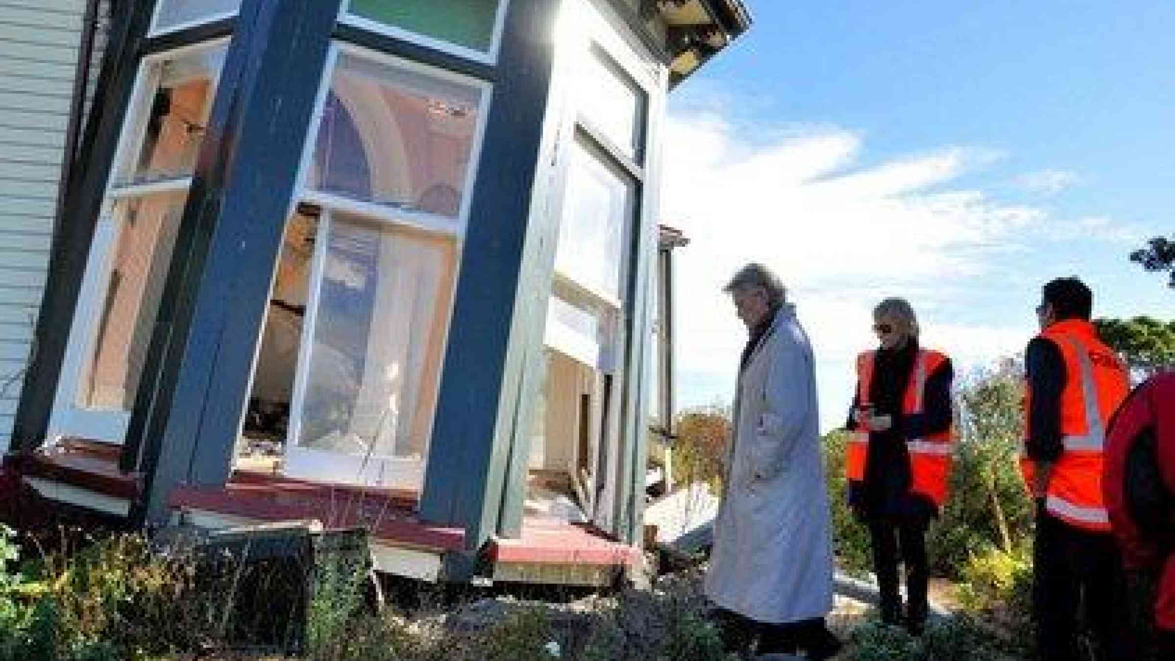 Margareta Wahlström surveys an area in danger of falling rocks along a cliff edge. Liquefaction, subsidence and lateral spreading was common following earthquakes that devastated Christchurch, New Zealand. (Photo / Jerry Velasquez)