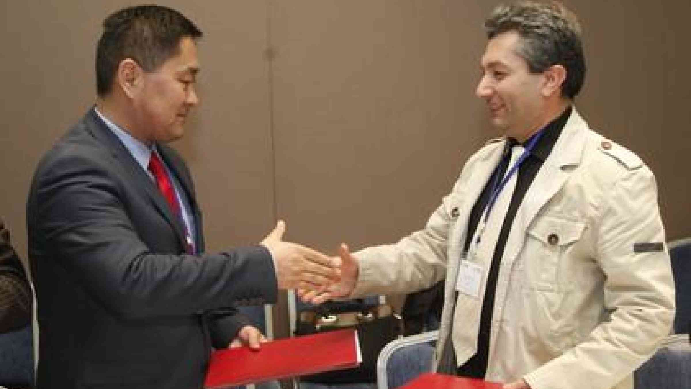 From left: Mr. Minbolot Bekzhanov, Head of the Secretariat of Kyrgyzstan's National Platform for Disaster Risk Reduction and Mr. Ara Barseghyan, Deputy Director of Armenia's National Platform for Disaster Risk Reduction following the signing of a partnership agreement.