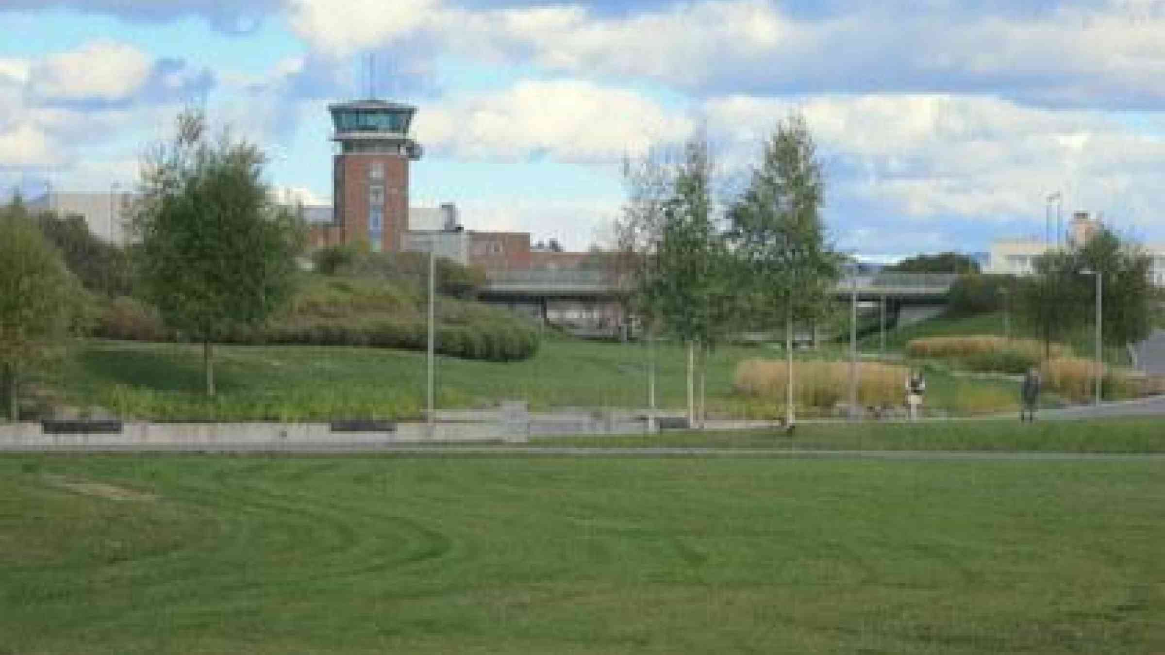 Closed in 1998, the control tower is the main remnant of the old Oslo airport and sits in the background of the new urban parkland at Fornebu.