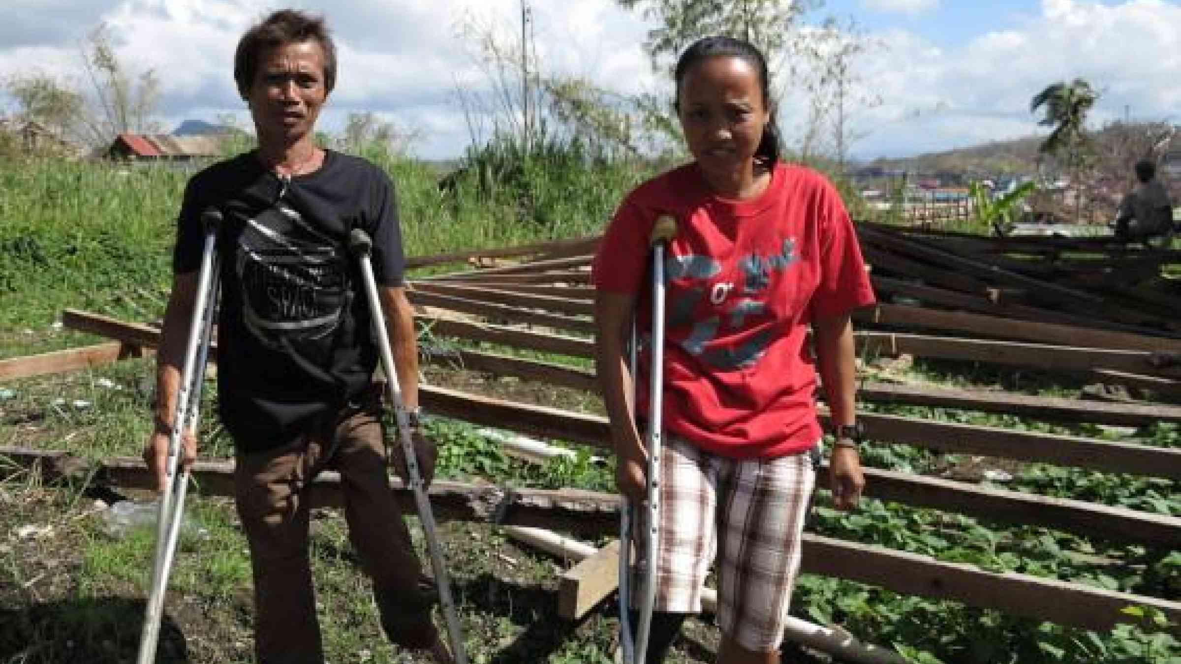 <b>Scared and hungry: </b>Myline (right) and several other women living with disabilities sheltered for eight days after the typhoon.