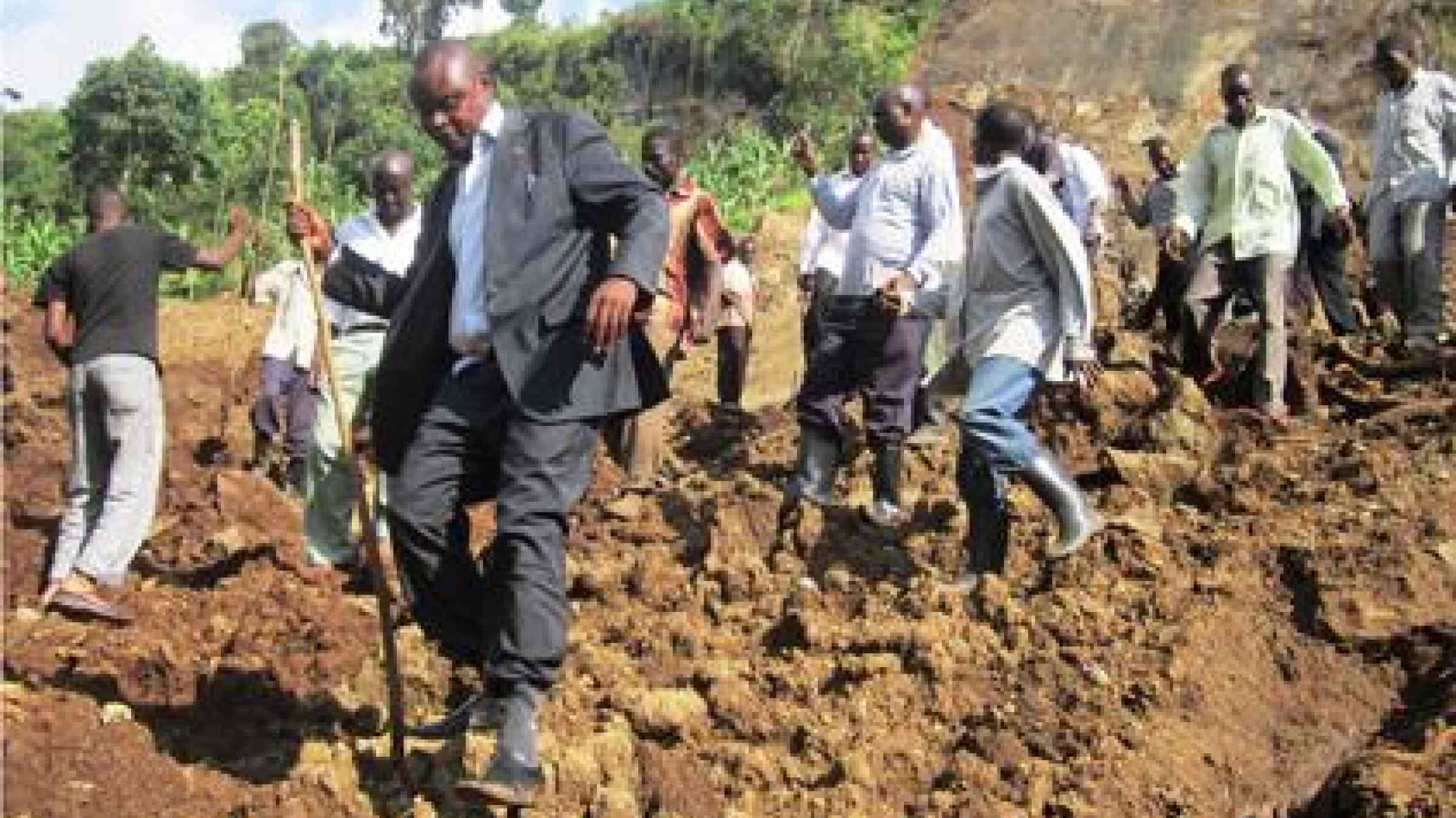 Local government officials inspect the scene of a 2013 landslide disaster in Uganda. (Photo: Denis Olaka/Uganda)