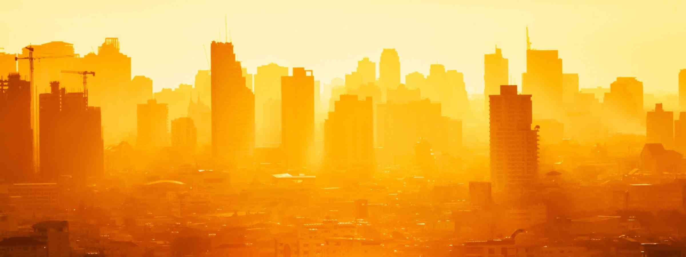 City heat Bangkok Thailand Sunrise over modern office buildings in business district center of Bangkok.